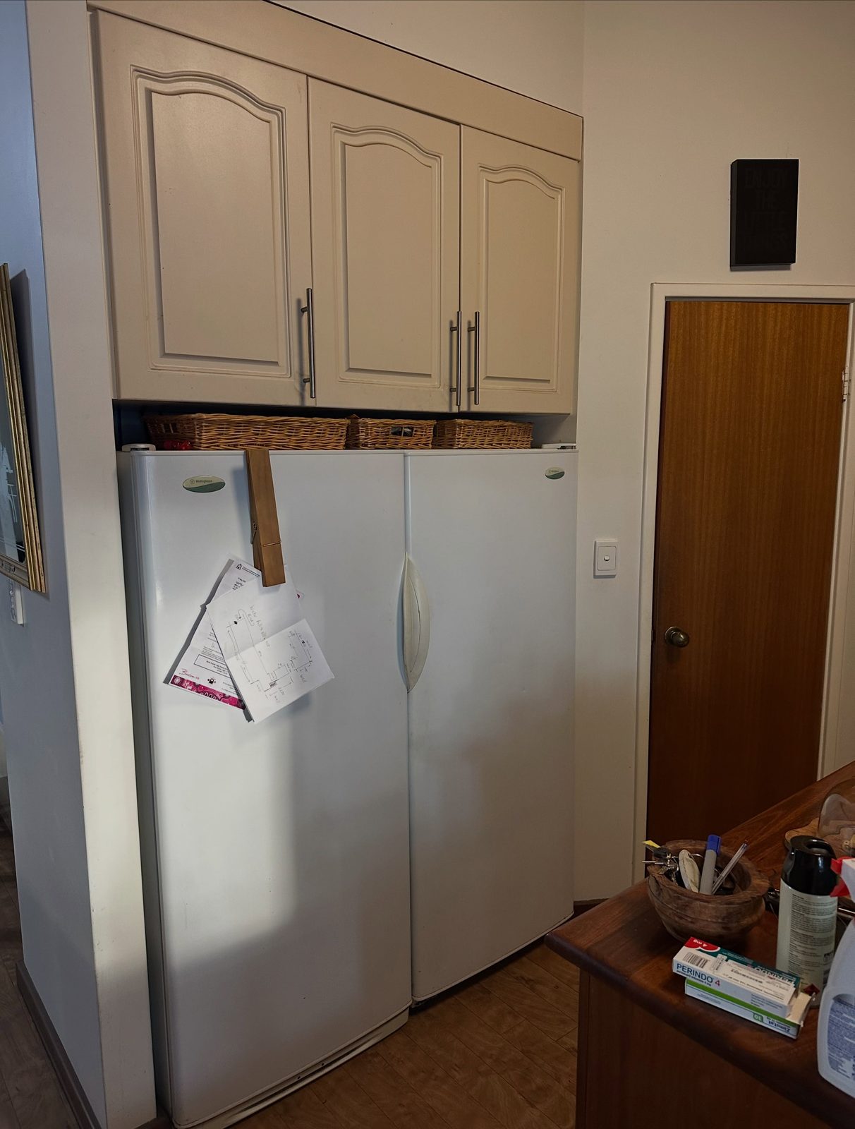 Before: the old fridge space and cupboards