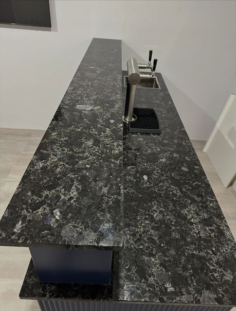 Close-up of the granite benchtop on the navy bar